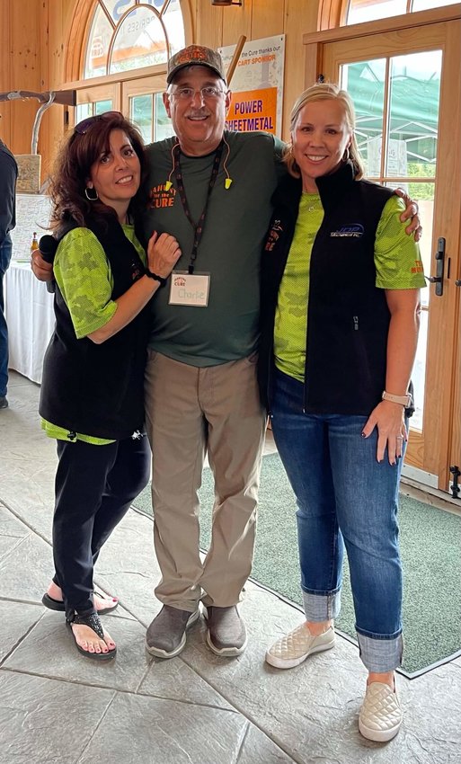 Raising funds for the community at DaHunt for the Cure. Diane Medici, fundraiser co-founder, left; Charlie Medici, co-founder; Elizabeth Rowley, president and CEO of Community Foundation of Orange and Sullivan.